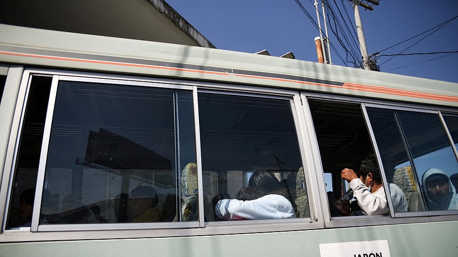 <div class="paragraphs"><p>Guatemalan migrants board a bus after arriving on deportation flights from the United States and Mexico, outside the Guatemalan Air Force base at La Aurora International Airport in Guatemala City, Guatemala, January 23, 2024. </p></div>