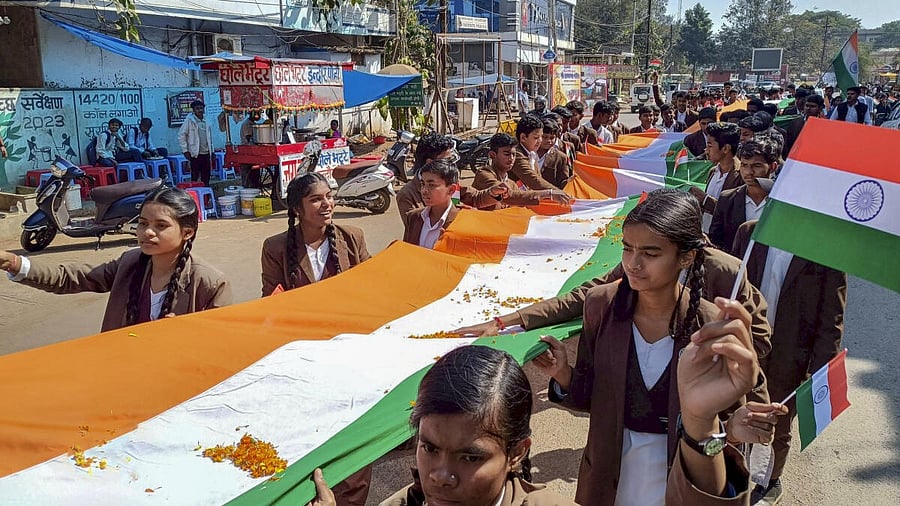 <div class="paragraphs"><p>Students take part in a procession with an 1100 feet long National flag on the eve of Republic Day, at Jagdalpur in Bastar district</p></div>