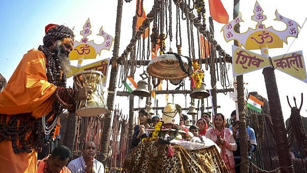 <div class="paragraphs"><p> A 'sadhu' performs rituals during the ongoing Maha Kumbh Mela 2025, at Sangam, in Prayagraj.&nbsp;</p></div>