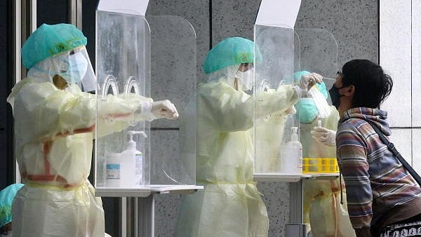 <div class="paragraphs"><p>A person gets a coronavirus test.</p></div>