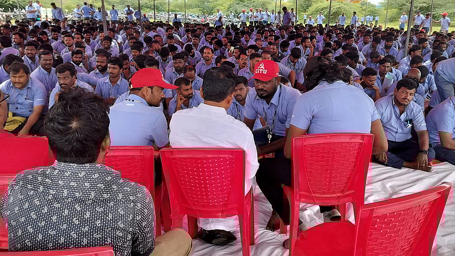 <div class="paragraphs"><p>A file image of Samsung workers speaking with union leader E Muthukumar during the strike that went on for 37 days. </p></div>