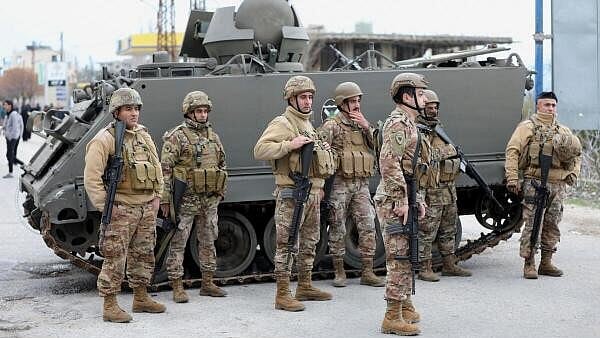 <div class="paragraphs"><p>Members of the Lebanese army secure the area in Burj al-Muluk, near the southern Lebanese village of Kfar Kila, as residents seek to return to homes in the border area where Israeli forces remained on the ground after a deadline for their withdrawal passed, Lebanon January 26, 2025.</p></div>