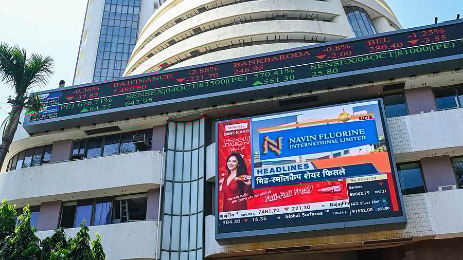 <div class="paragraphs"><p>People walk past the Bombay Stock Exchange (BSE) building</p></div>
