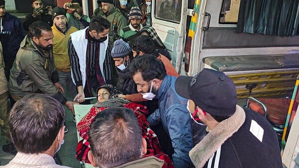 <div class="paragraphs"><p>A patient from the Badhaal village being taken to a hospital amid the deaths of at least 17 people belonging to three families, under suspicious circumstances, in Jammu and Kashmir's Rajouri district, Wednesday, Jan. 22, 2025. The village was declared a containment zone and prohibitory orders imposed on all public and private gatherings.</p></div>