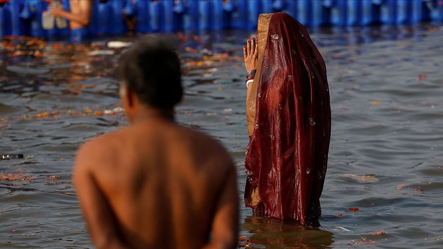 <div class="paragraphs"><p>A devotee takes a holy dip at Sangam, the confluence of the Ganges and Yamuna rivers with the mythical, invisible Saraswati river, during the "Maha Kumbh Mela", or the Great Pitcher Festival, in Prayagraj, January 28, 2025. </p></div>