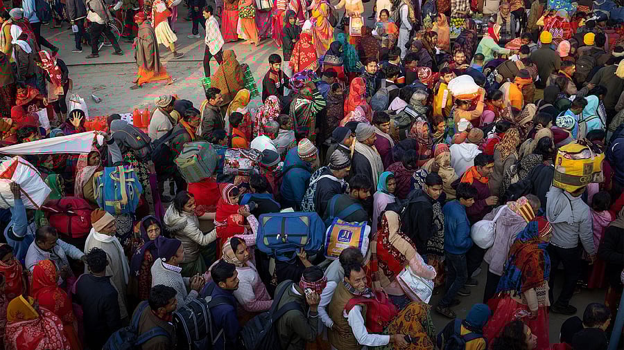 <div class="paragraphs"><p>Devotees gather at the river bank to take a holy dip at Sangam, </p></div>