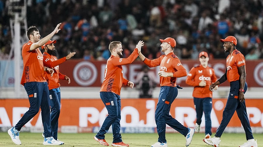 <div class="paragraphs"><p>England players celebrate the win.</p></div>