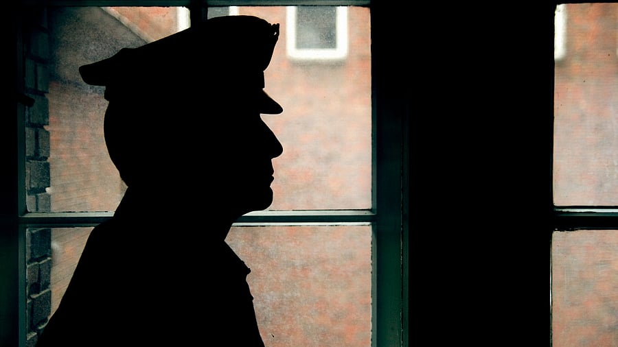 <div class="paragraphs"><p>Representative image showing the silhouette of a police personnel</p></div>