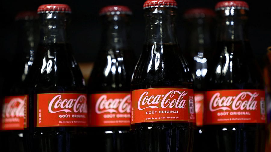 <div class="paragraphs"><p>Bottles of Coca-Cola are displayed on a shelf in a supermarket.&nbsp;</p></div>