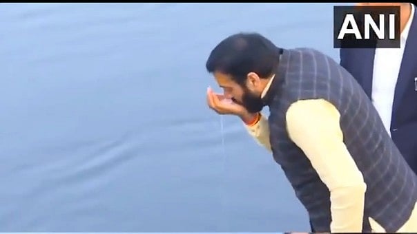 <div class="paragraphs"><p>Nayab Singh Saini takes sip of water from River Yamuna</p></div>