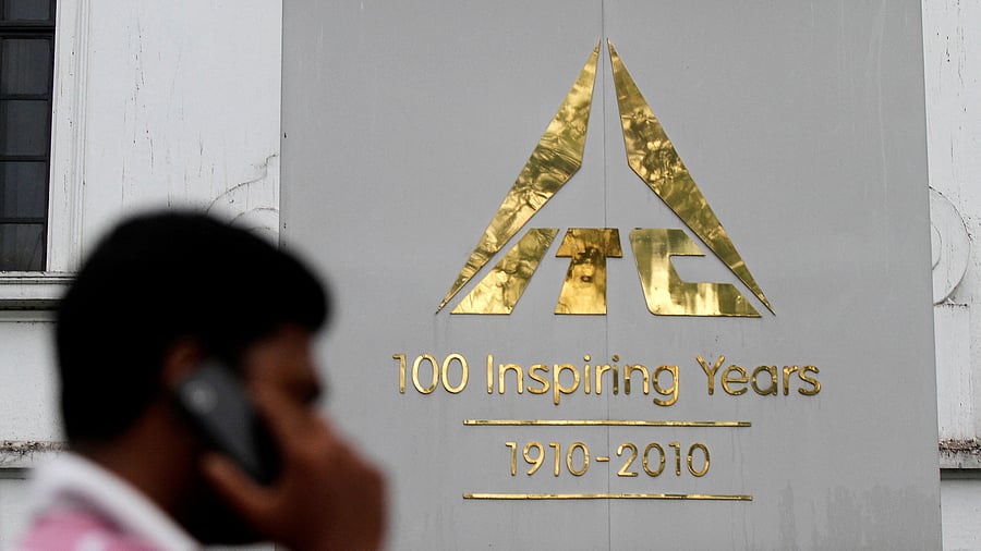 <div class="paragraphs"><p>A man walks past the ITC logo outside their office in Kolkata.</p></div>