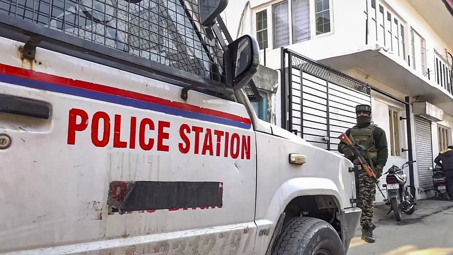 <div class="paragraphs"><p>A security personnel keeps vigil as the National Investigation Agency carried out raids at several places of J&amp;K, in connection with a terror-related case, in Srinagar</p></div>