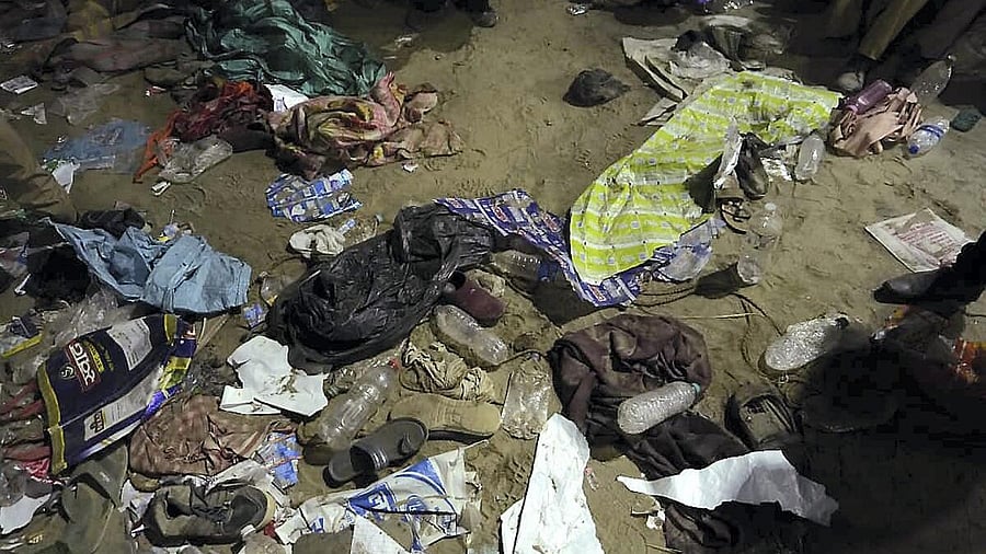 <div class="paragraphs"><p> Belongings of devotees are seen lying on the ground after the stampede</p></div>