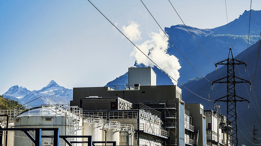 <div class="paragraphs"><p>Smoke rising up from industrial area to blue sky in the swiss mountain landscape. Representative image.</p></div>