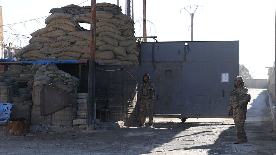 <div class="paragraphs"><p>Members of Kurdish-led Syrian Democratic Forces stand guard outside al-Sina'a prison in Hasakah, Syria, January 18, 2025. </p></div>