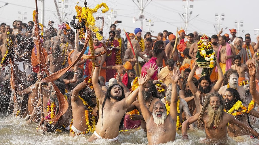 <div class="paragraphs"><p>Sadhus take a holy dip at the Triveni Sangam on the occasion of 'Mauni Amavasya', in Prayagraj. </p></div>
