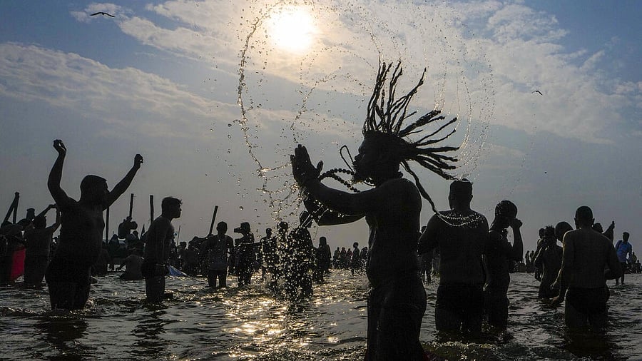 <div class="paragraphs"><p>Devotees take a holy dip at Sangam on Mauni Amavasya during the ongoing Mahakumbh Mela, in Prayagraj.</p></div>