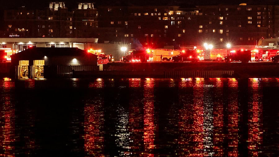 <div class="paragraphs"><p>Emergency service vehicles stand near the site of the crash after American Eagle flight 5342 collided with a helicopter while approaching Reagan Washington National Airport and crashed in the Potomac River, outside Washington, US, January 29, 2025.</p></div>