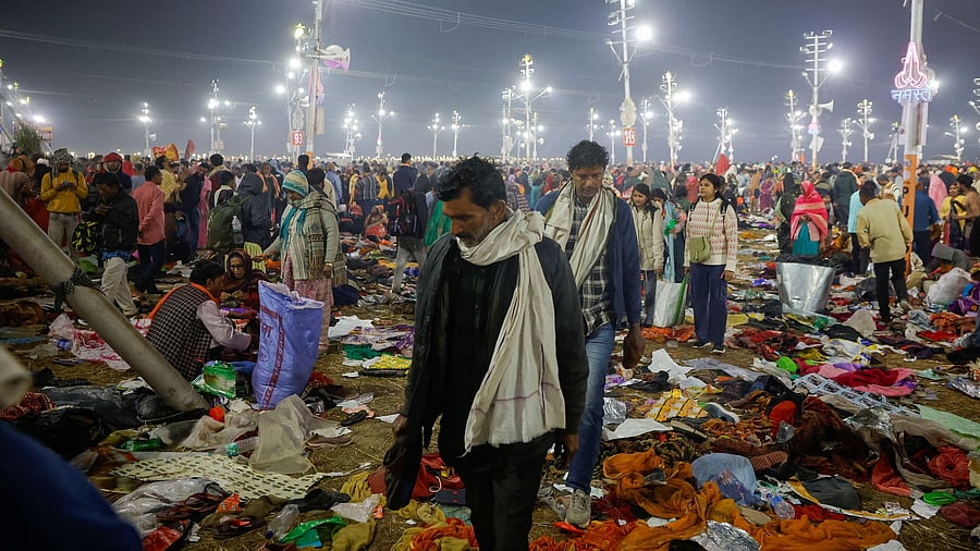 <div class="paragraphs"><p>Devotees walk as they leave after a deadly stampede </p></div>