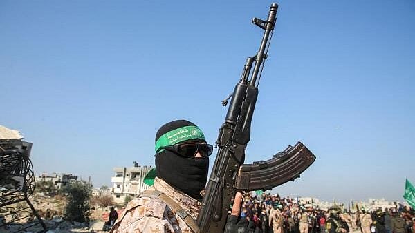 <div class="paragraphs"><p>A Palestinian Hamas militant stands guard, on the day of the release of hostages held in Gaza since the deadly October 7 2023 attack, as part of a ceasefire deal in Gaza between Hamas and Israel, in Khan Younis in the southern Gaza Strip.</p></div>