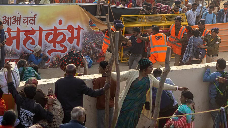 <div class="paragraphs"><p>Security personnel scuffle with devotees who entered a railway station by jumping over a wall, as they leave after attending the "Maha Kumbh Mela", or the Great Pitcher Festival, a day after a deadly stampede, in Prayagraj.</p></div>
