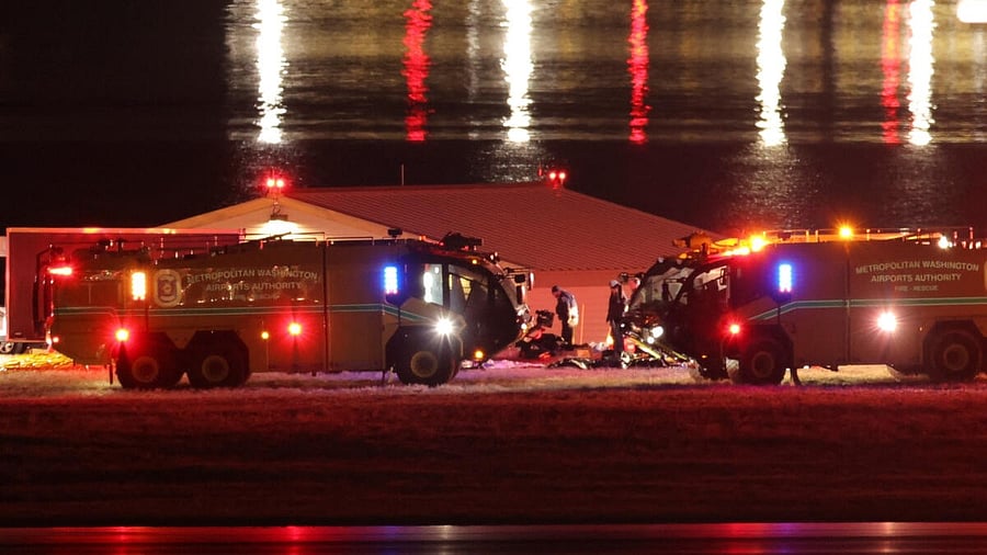 <div class="paragraphs"><p>Emergency personnel work near the site of the crash after American Eagle flight 5342 collided with a Black Hawk helicopter while approaching Reagan Washington National Airport and crashed into the Potomac River, outside Washington</p></div>