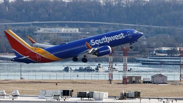 <div class="paragraphs"><p>A plane departs Ronald Reagan Washington National Airport, as search and rescue teams work, in the aftermath of the collision of American Eagle flight 5342 and a Black Hawk helicopter that crashed into the Potomac River,</p></div>