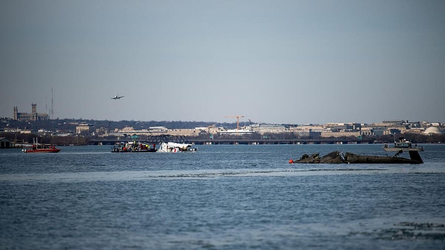 <div class="paragraphs"><p>US Coast Guard, along with other search and rescue teams, operate near debris at the crash site in the Potomac River in a location given as Washington, in the aftermath of the collision of American Eagle flight 5342 and a Black Hawk helicopter that crashed into the Potomac River, U.S. January 30, 2025.</p></div>