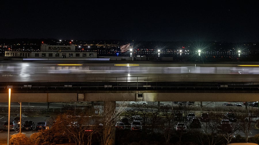 <div class="paragraphs"><p>An American flag flutters in the wind at Ronald Reagan Washington National Airport, in the aftermath of the collision of American Eagle flight 5342 and a Black Hawk helicopter that crashed into the Potomac River, in Arlington, Virginia, U.S., January 30, 2025. </p></div>