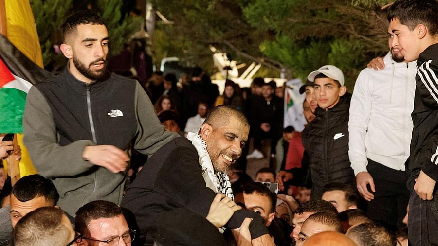 <div class="paragraphs"><p>Freed prisoner Zakaria Zubeidi, a former high-profile commander of the Fatah group's Al Aqsa Martyrs Brigades is greeted, after being released from an Israeli jail as part of a hostages-prisoners swap and a ceasefire deal in Gaza between Hamas and Israel, in Ramallah.</p></div>