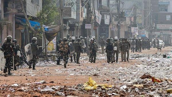 <div class="paragraphs"><p>Security personnel conduct patrolling as they walk past Bhagirathi Vihar area of the riot-affected north east Delhi, Wednesday, Feb. 26, 2020. At least 22 people have lost their lives in the communal violence over the amended citizenship law as police struggled to check the rioters who ran amok on streets, burning and looting shops, pelting stones and thrashing people.</p></div>
