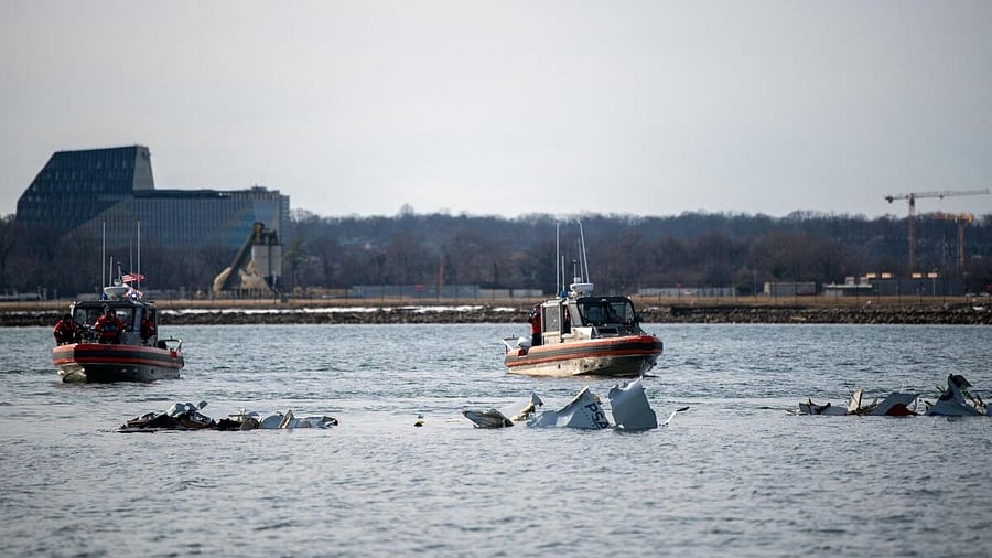 <div class="paragraphs"><p>US Coast Guard, along with other search and rescue teams, operate near debris at the crash site in the Potomac River in a location given as Washington, in the aftermath of the collision of American Eagle flight 5342 and a Black Hawk helicopter that crashed into the Potomac River, US.</p></div>