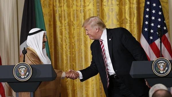 <div class="paragraphs"><p>File photo of U.S. President Donald Trump (R) greeting Emir of Kuwait Sabah Al-Ahmad Al-Jaber Al-Sabah during a joint news conference in the East Room of the White House in Washington, U.S.</p></div>