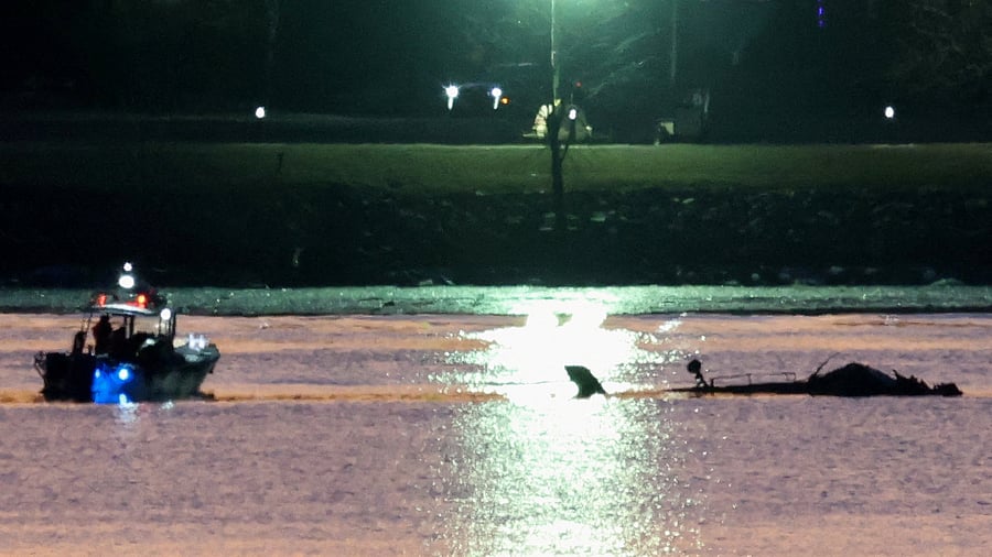<div class="paragraphs"><p>Rescuers on a boat work next to the wreckage of a Black Hawk helicopter at the site of the crash after it collided with the American Eagle flight 5342 which was approaching Reagan Washington National Airport and crashed into the Potomac River, outside Washington, US, January 30, 2025.</p></div>