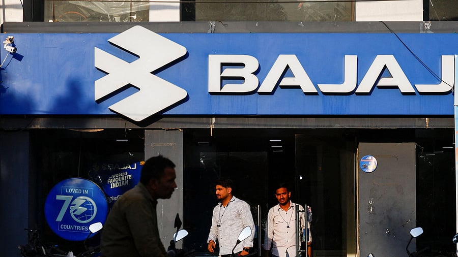 <div class="paragraphs"><p>Men exit a Bajaj Auto Ltd. dealer shop in New Delhi</p></div>