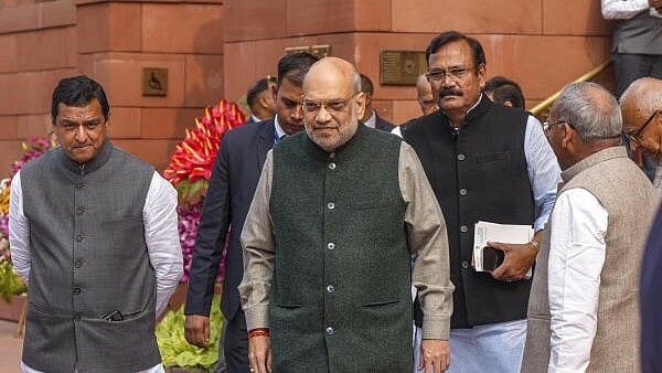 <div class="paragraphs"><p>Union Home Minister Amit Shah, center, BJP MP Anil Baluni, left, and others during the Budget session of Parliament, in New Delhi, on Saturday.</p></div>