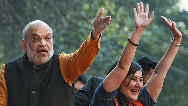 <div class="paragraphs"><p>Union Home Minister and BJP leader Amit Shah with party MP Bansuri Swaraj during a roadshow in support of party candidate</p></div>