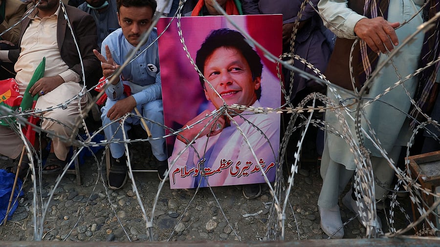 <div class="paragraphs"><p>FILE PHOTO: A supporter of jailed former Pakistani Prime Minister Imran Khan's party, the Pakistan Tehreek-e-Insaf , reacts as he along with others attend a rally demanding his release in Swabi, Pakistan.</p></div>
