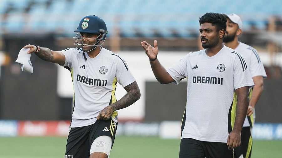 <div class="paragraphs"><p>India captain Suryakumar Yadav with teammate Sanju Samson during a training session.</p></div>