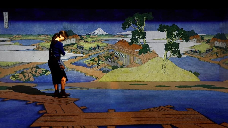 <div class="paragraphs"><p>A visitor attends an exhibition that uses cutting-edge technology to bring to life the work of iconic samurai-era ukiyo-e artist Katsushika Hokusai at 'HOKUSAI: ANOTHER STORY in TOKYO', technical wizardry from Sony PCL Inc. and Ars Techne Corp, and the woodblock prints provided by the Yamanashi Prefectural Museum that owns the original work, during a preview event in Tokyo, Japan.</p></div>