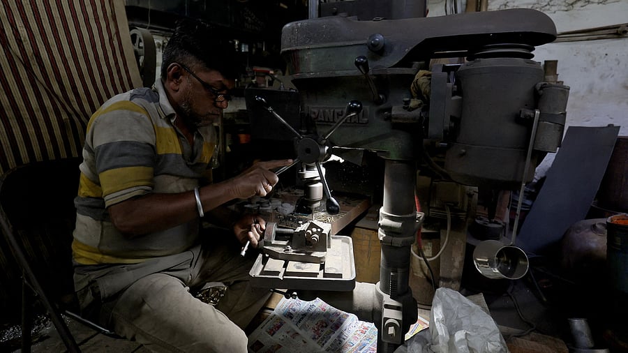 <div class="paragraphs"><p>A worker operates a machine inside a small scale manufacturing unit. Representative image </p></div>