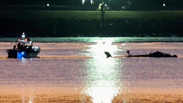 <div class="paragraphs"><p>Rescuers on a boat work next to the wreckage of a Black Hawk helicopter at the site of the crash after it collided with the American Eagle flight 5342 which was approaching Reagan Washington National Airport and crashed into the Potomac River, outside Washington, US, January 30, 2025.</p></div>