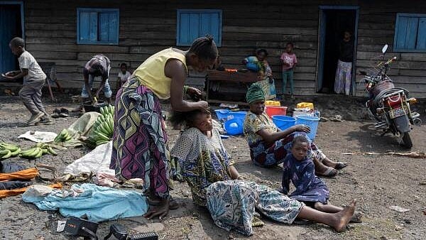 <div class="paragraphs"><p>People take refuge following the intensification of fighting between M23 rebels and the Congolese army, in Goma</p></div>