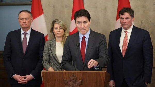 <div class="paragraphs"><p>Canada's Prime Minister Justin Trudeau is joined by Finance Minister Dominic LeBlanc, Minister of Foreign Affairs Melanie Joly, and Minister of Public Safety David McGuinty, as he speaks during a press conference while responding to U.S. President Donald Trump's orders to impose 25% tariffs on Canadian imports, in Ottawa, Ontario, Canada.</p></div>