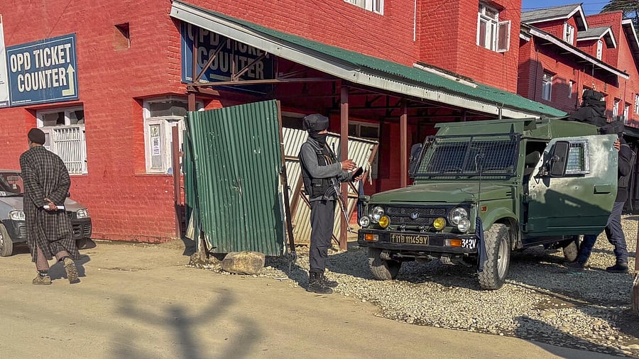 <div class="paragraphs"><p>Security personnel keep vigil after a militant attack, in Kulgam district, Monday, Feb. 3, 2025. An ex-Army man succumbed to his injuries while his wife and daughter are stable.</p></div>