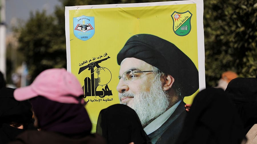 <div class="paragraphs"><p>Students hold a poster of Lebanon's late Hezbollah leader Sayyed Hassan Nasrallah, as they demonstrate to show support to the Palestinians in the Gaza Strip at the campus of Sanaa University, in Sanaa, Yemen.</p></div>
