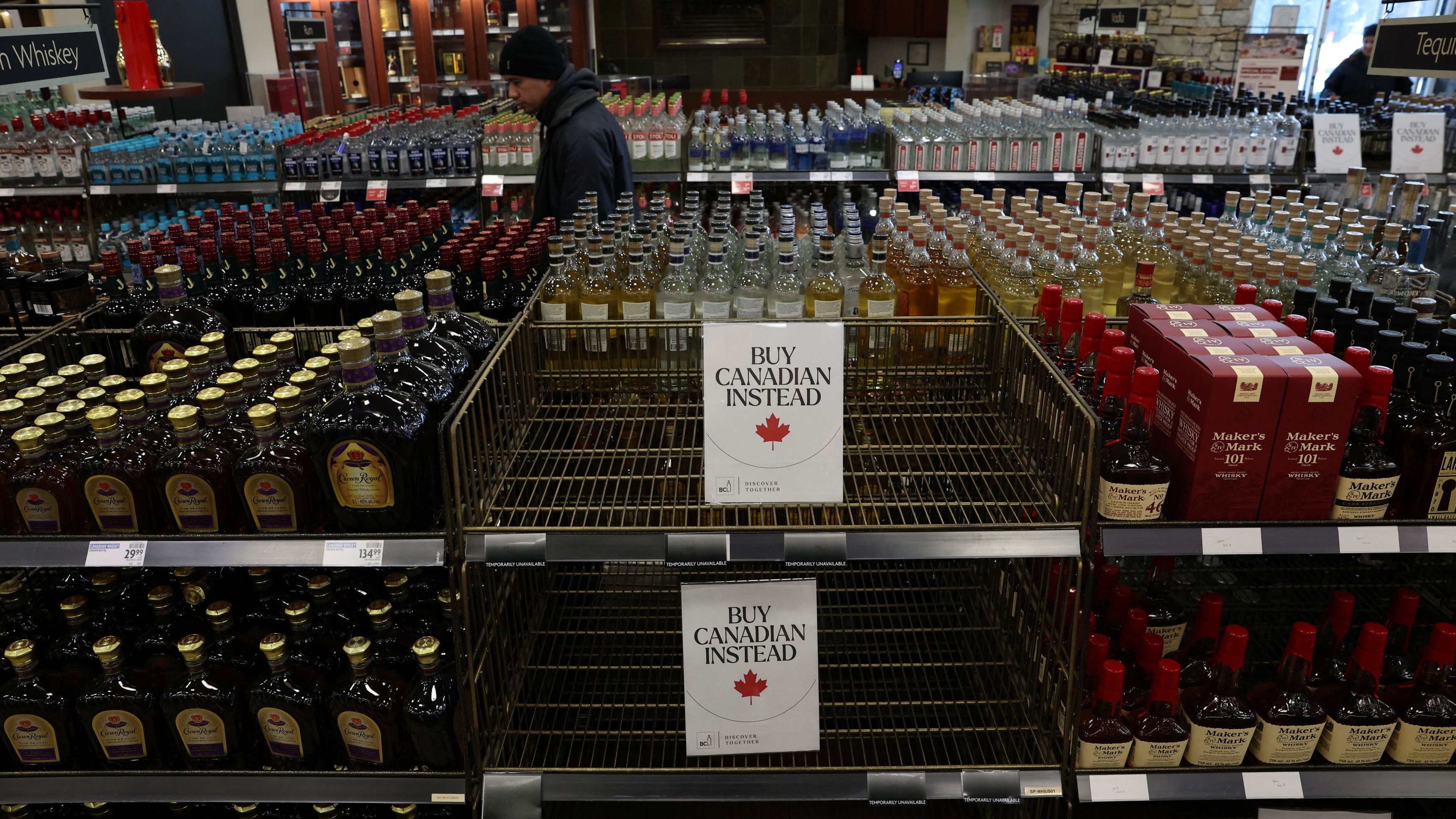 <div class="paragraphs"><p>Empty shelves remain with signs ''Buy Canadian Instead'' after the top five U.S. liquor brands were removed from sale at a BC Liquor Store, in Vancouver</p></div>