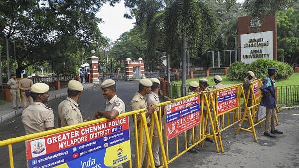 <div class="paragraphs"><p>Police personnel stand guard outside the Anna University campus.</p></div>