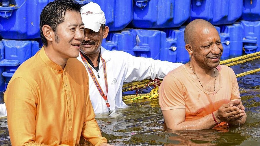 <div class="paragraphs"><p>Uttar Pradesh Chief Minister Yogi Adityanath and Bhutan's King Jigme Khesar Namgyel Wangchuck take a dip at Sangam during the ongoing Maha Kumbh Mela, in Prayagraj.</p></div>