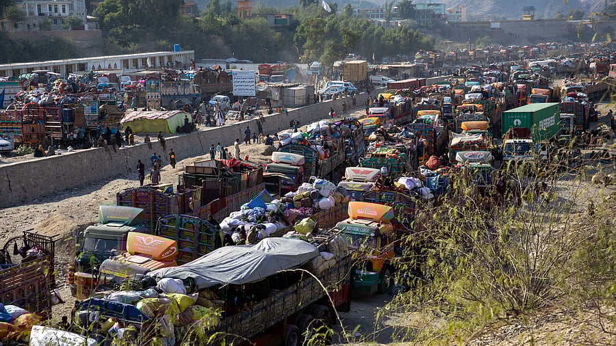 <div class="paragraphs"><p>Trucks loaded with goods are seen as Afghan nationals head back to Afghanistan, at the Torkham border crossing between Pakistan and Afghanistan</p></div>